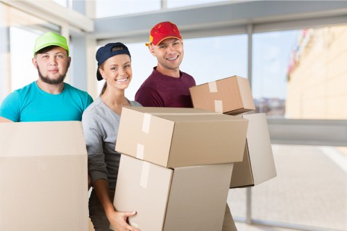 Professional flat removals in Finchley with movers handling boxes